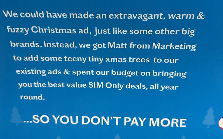 Close-up of London Underground Christmas advert copy about Matt from Marketing adding tiny trees to existing Lebara ads.