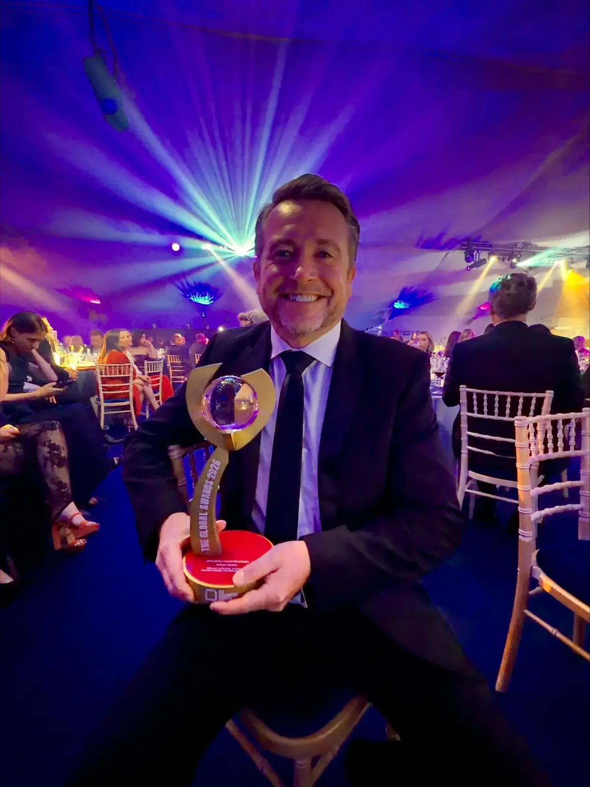 Laurence Bray holding the Holistic Growth Story Award